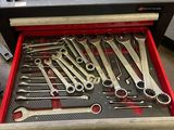 a drawer full of tools that are sitting on a table