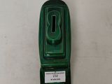 a green hand sanitizer on a white table