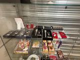 a glass display case with various items in it