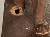 statue of a horse with a hole in the middle of it ' s body