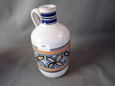 a white vase with a blue and orange design on it