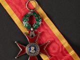 an image of a red and yellow ribbon with a star on it