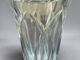 a glass vase that is sitting on a table