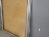 a picture of a picture frame leaning against a wall