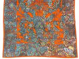 an orange and blue paisley print pocket square