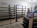 a store with a lot of empty shelves in it