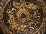 gold and black plate with ornate design on a black background