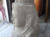 a stone statue of a woman with a headdress on