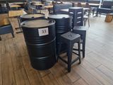 several barrels sitting on the floor of a restaurant