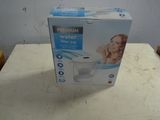 packaging of a water purifier sitting on top of a table