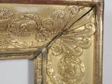 a picture of a gold frame with a picture on it