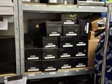 many boxes and boxes on the shelves in the room