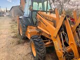 a tractor that is parked on the side of the road
