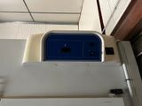 an image of a white refrigerator with a blue top