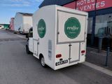 a white truck that is parked in front of a building