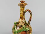 an image of a vase with a handle on it