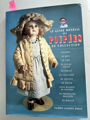 a book with a doll in it on a table