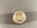 a small metal object that is on a table