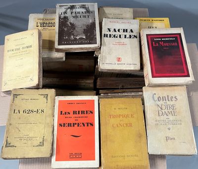 several books are stacked on top of each other on a table