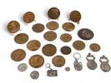 a lot of coins that are on a white surface