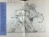 an open book with a drawing of a man and an elephant
