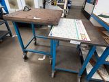 a workbench in the middle of a room with a lot of work on it
