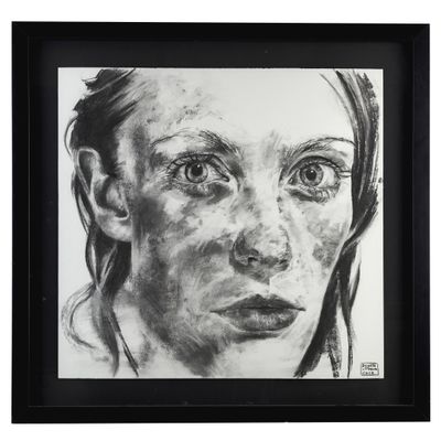 black and white drawing of a woman ' s face in a black frame