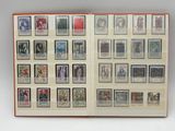 an open book with a bunch of different stamps on it