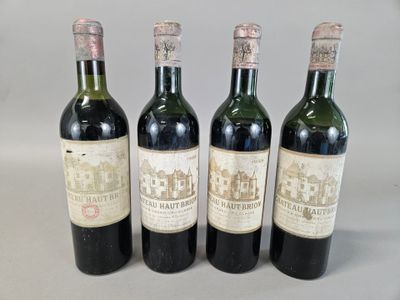 three bottles of wine are lined up on a table