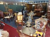 a room filled with furniture and a lot of chairs