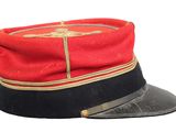a red and black hat with a gold emblem on it