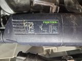 a close up view of a car ' s engine and exhaust pipe