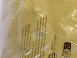 a plastic bag with a piece of yellow paper in it