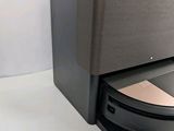 an image of a toilet with a toilet paper dispenser attached to it