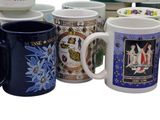 many different colored coffee mugs lined up on the table