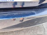 a close up of a car ' s bumper with a sticker on it