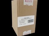 a cardboard box with a sticker on it on a black background