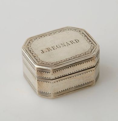 an antique silver box with the word bergnap engraved on it