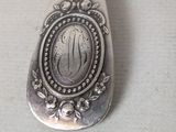 a spoon that has a picture of a woman on it