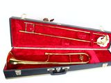 a case with a trumpet inside of it on a white surface