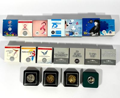 a lot of different types of coins in a display case