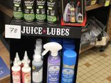 bottles of juice and other cleaning products are on display in a store
