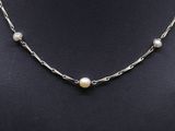 a pearl and silver necklace on a mannequin mannequin mannequin mannequin mannequin mannequin mannequin mannequin mann