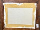 an old picture frame with a piece of paper taped to it