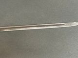 a knife that is laying on a table