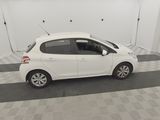 a picture of a white car parked in a garage