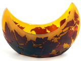 a yellow and brown bowl with leaves on it