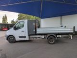 a white truck that is parked under a blue tent