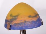 a lamp that is on a tripod stand