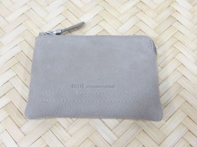 a small gray purse with a zipper on it